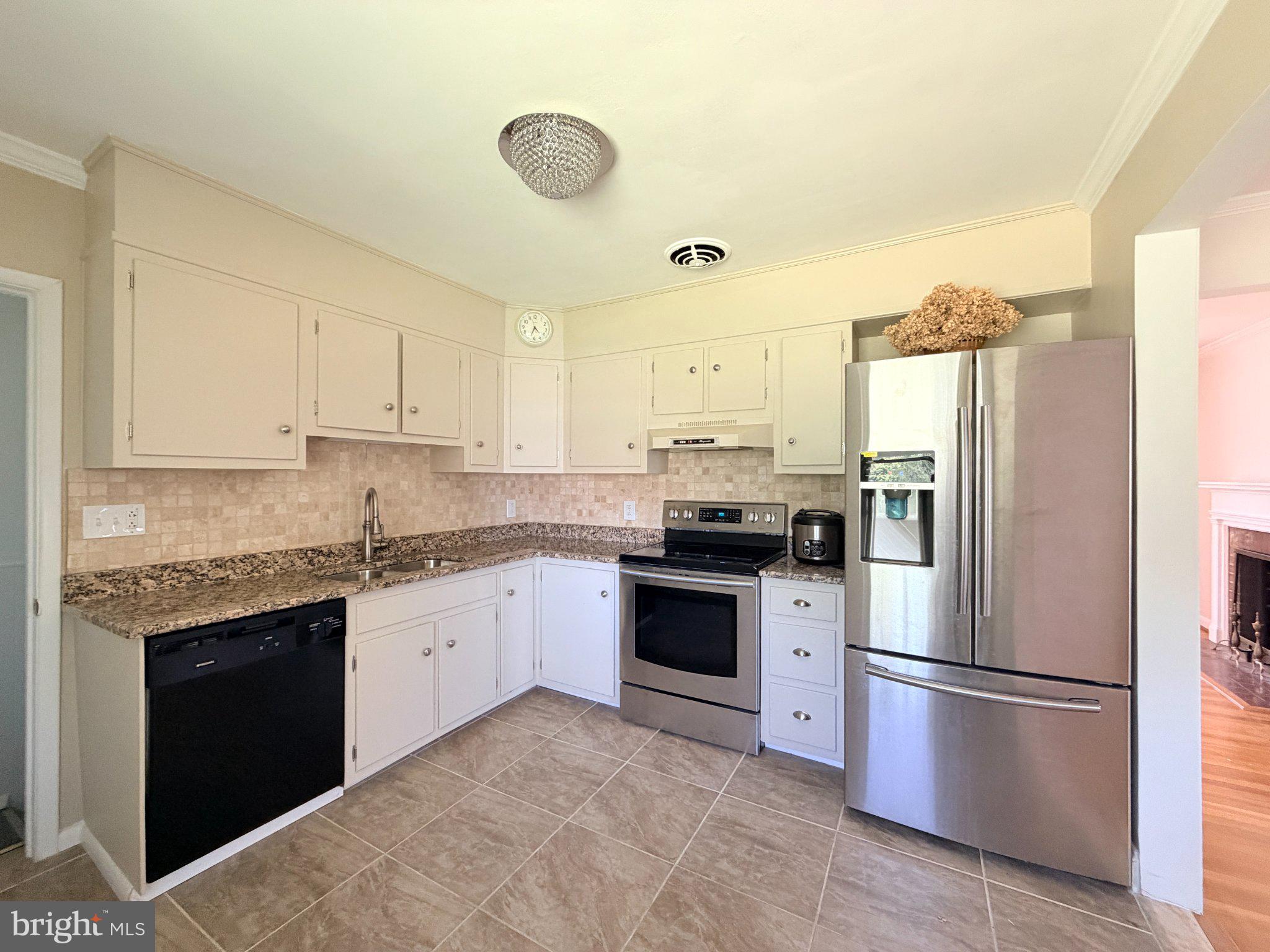 6 East Aylesbury Road Lutherville-Timonium, MD 21093 - Photo 7 of 19 Modern kitchen with sleek finishes.