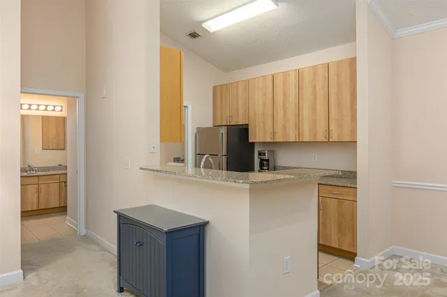 a view of a kitchen with electric appliances