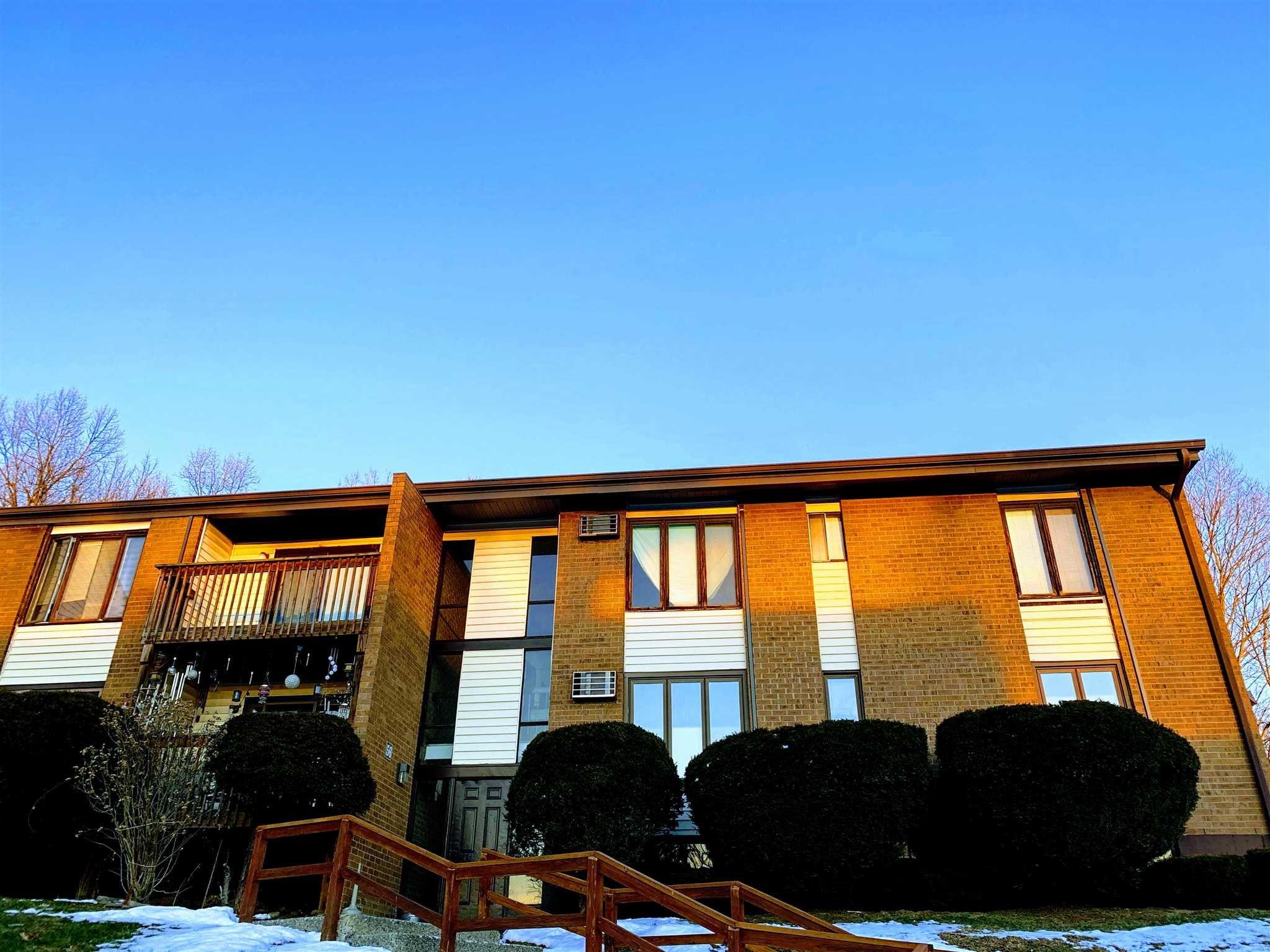 a view of a living room and balcony