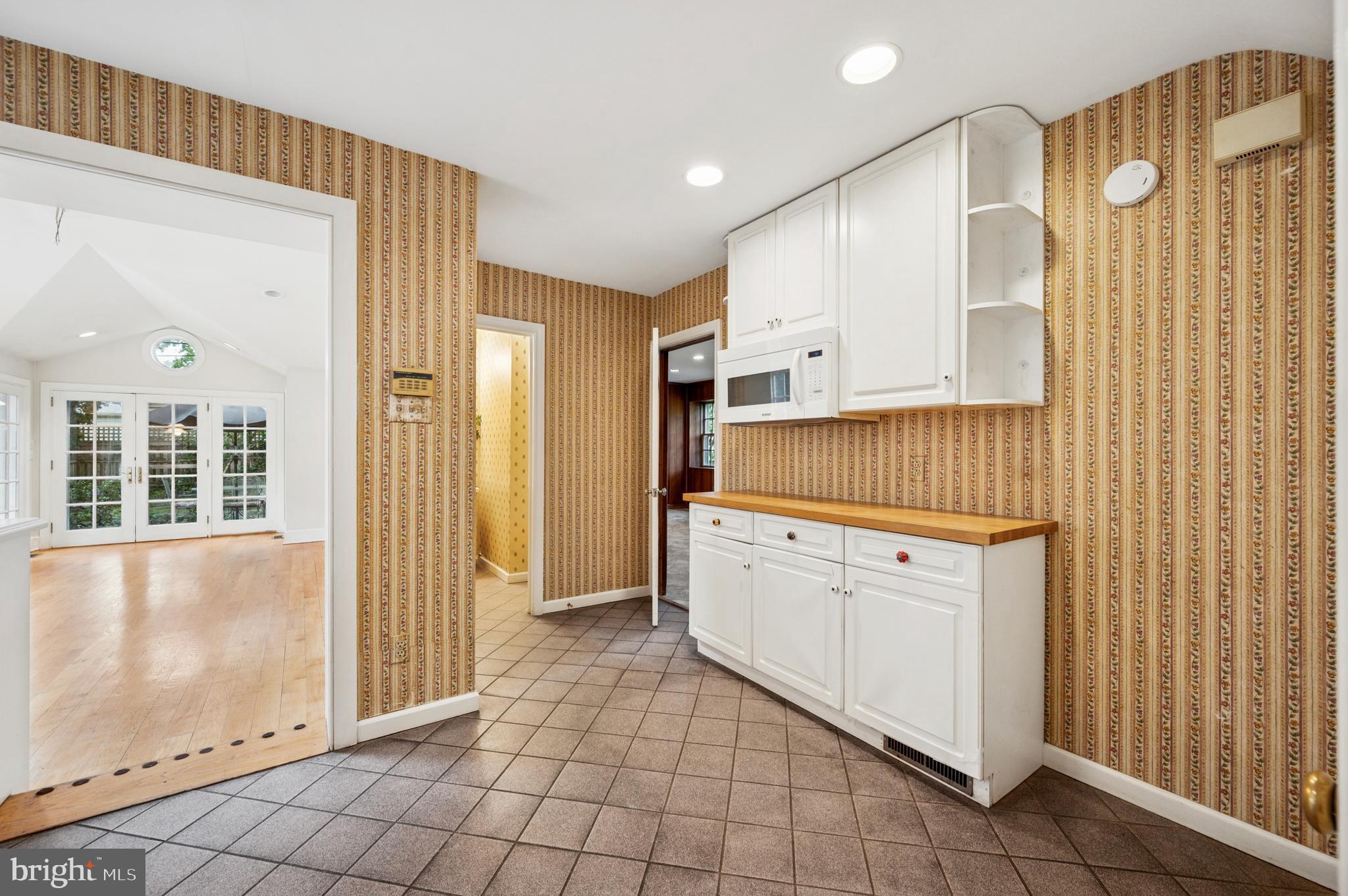 524 Lafayette Road Merion Station, PA 19066 - Photo 12 of 25 a kitchen with white cabinets and window