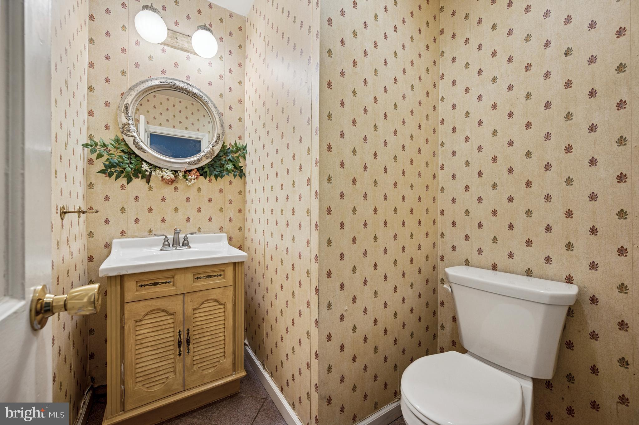 524 Lafayette Road Merion Station, PA 19066 - Photo 15 of 25 a bathroom with a toilet a sink and a mirror