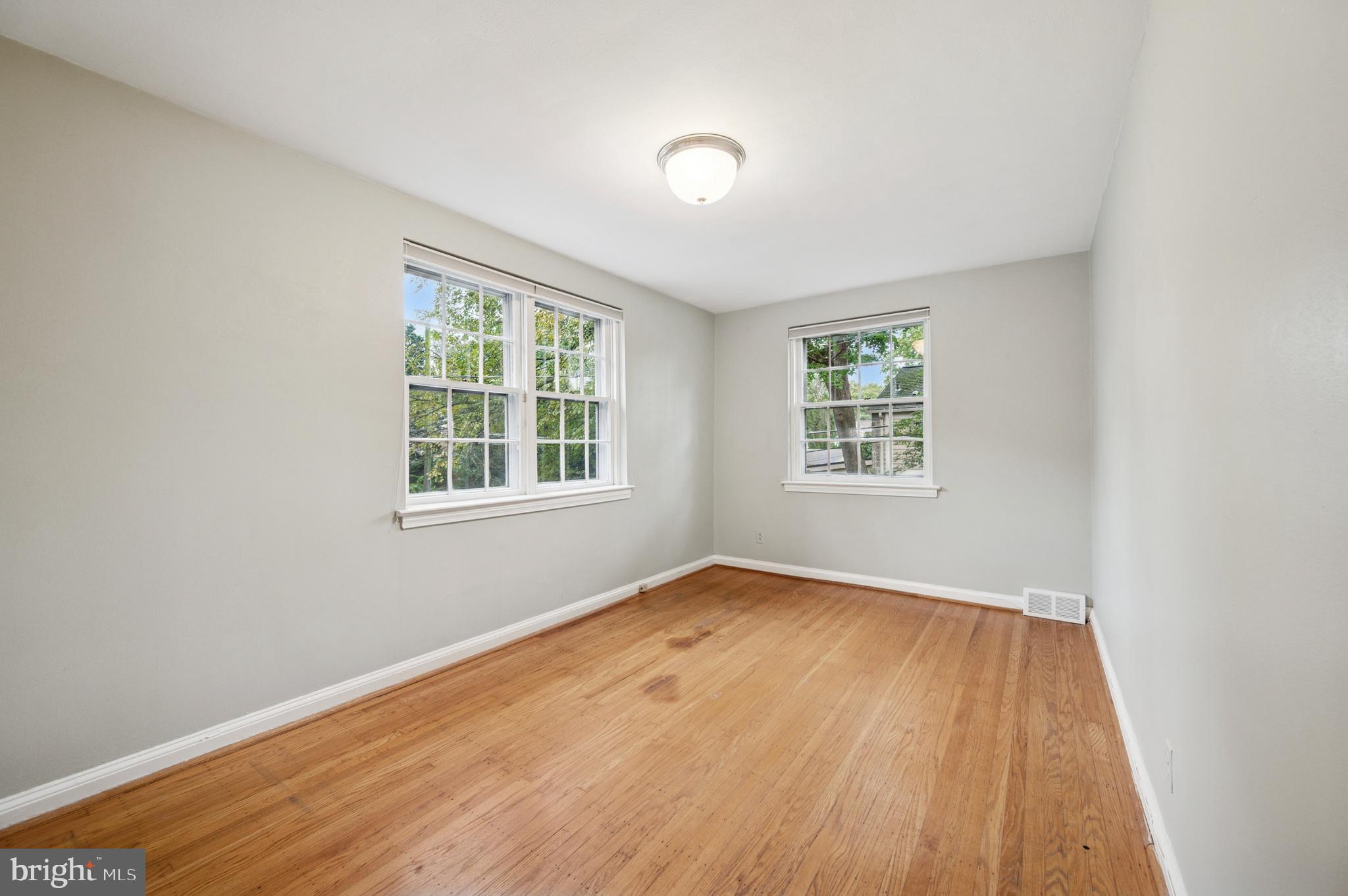 524 Lafayette Road Merion Station, PA 19066 - Photo 18 of 25 an empty room with wooden floor and windows
