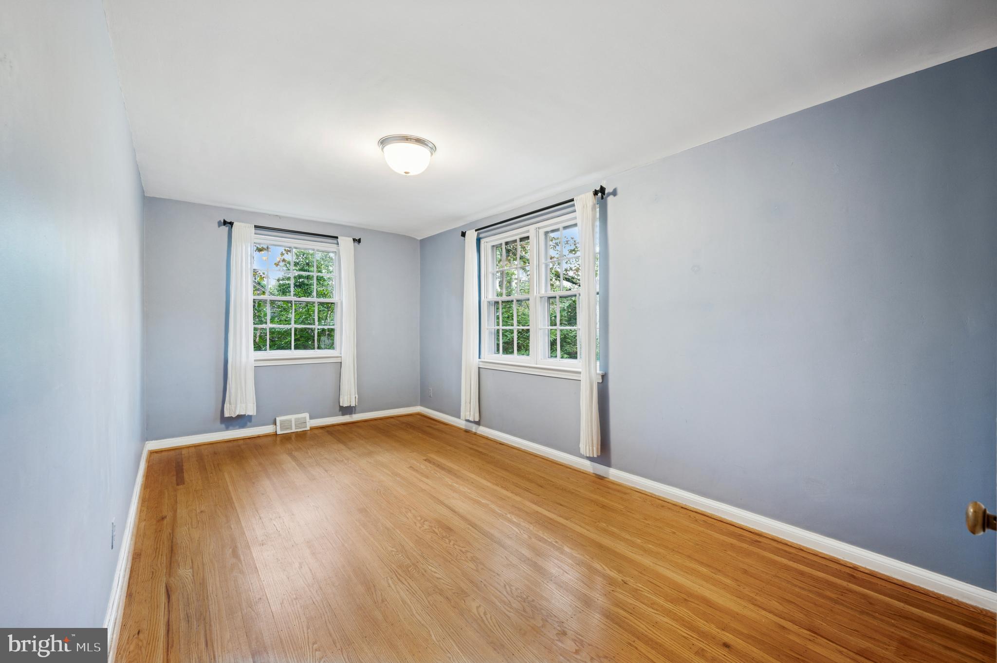 524 Lafayette Road Merion Station, PA 19066 - Photo 19 of 25 a view of a bedroom with wooden floor and windows