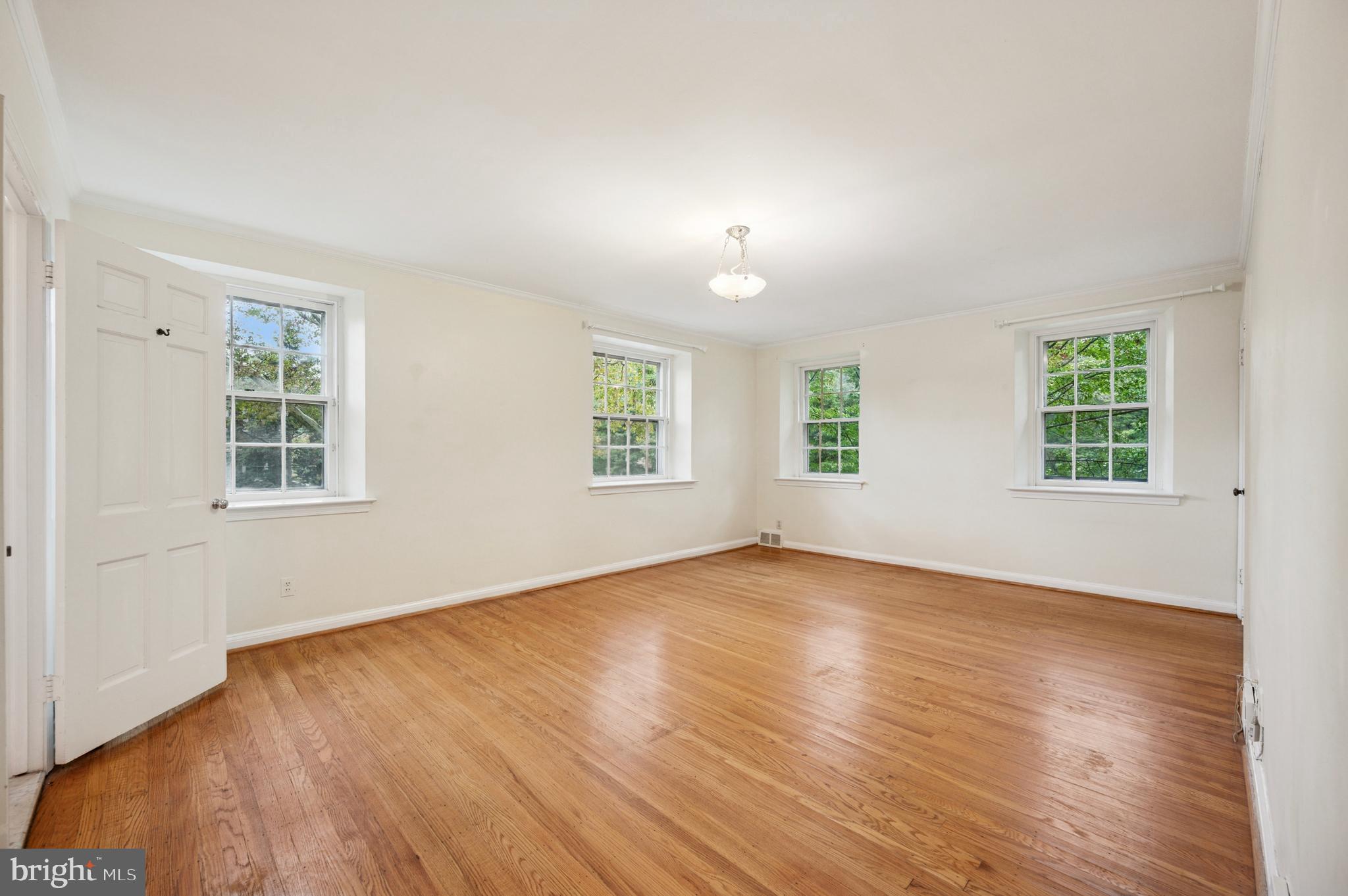 524 Lafayette Road Merion Station, PA 19066 - Photo 20 of 25 an empty room with wooden floor and windows