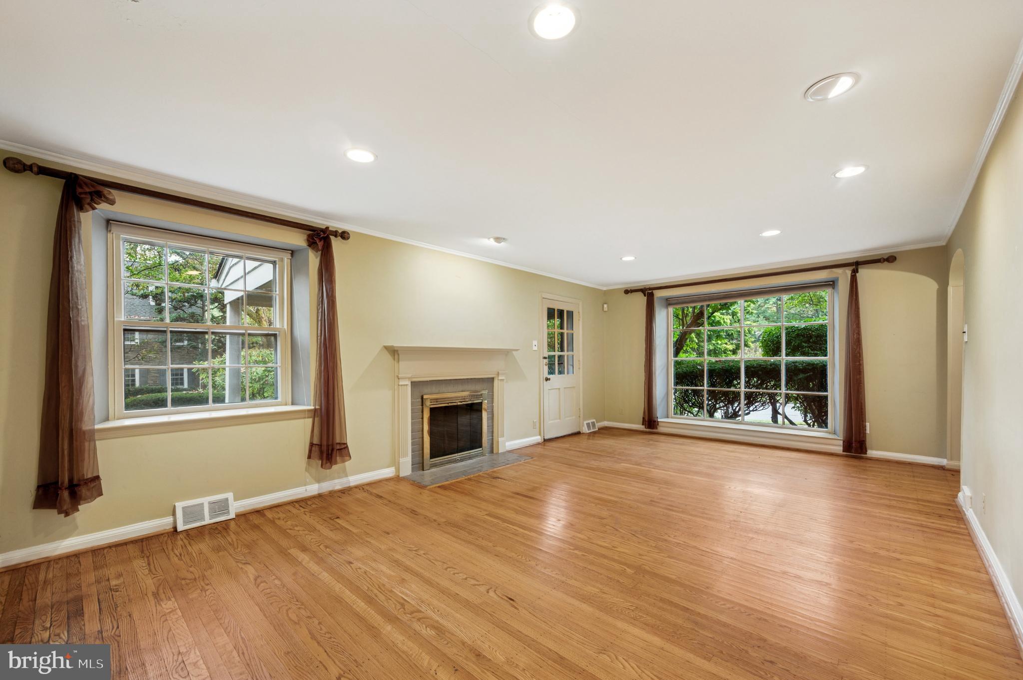 524 Lafayette Road Merion Station, PA 19066 - Photo 2 of 25 a view of an empty room with wooden floor and a window
