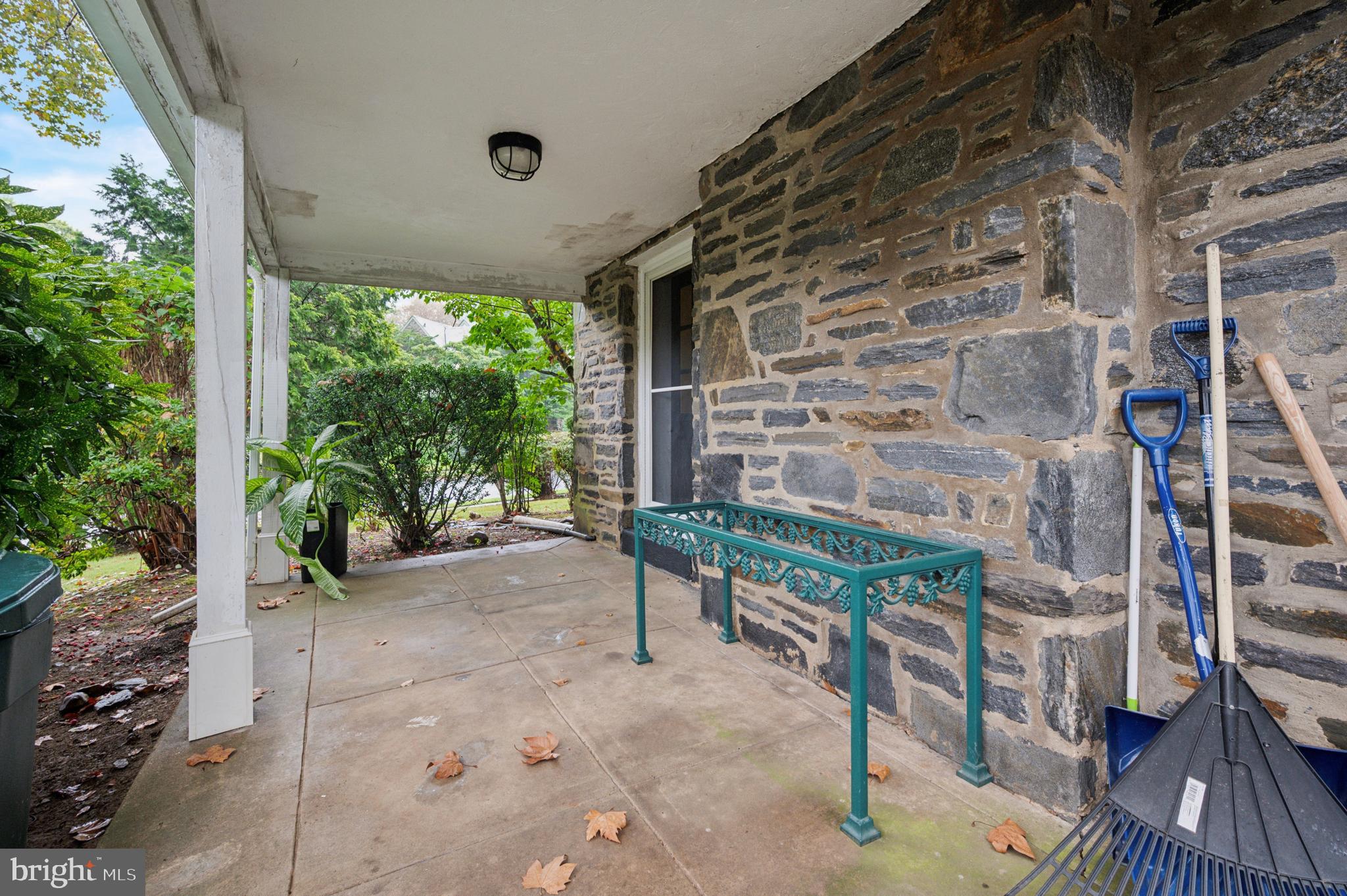 524 Lafayette Road Merion Station, PA 19066 - Photo 22 of 25 a wooden bench sitting in front of a building