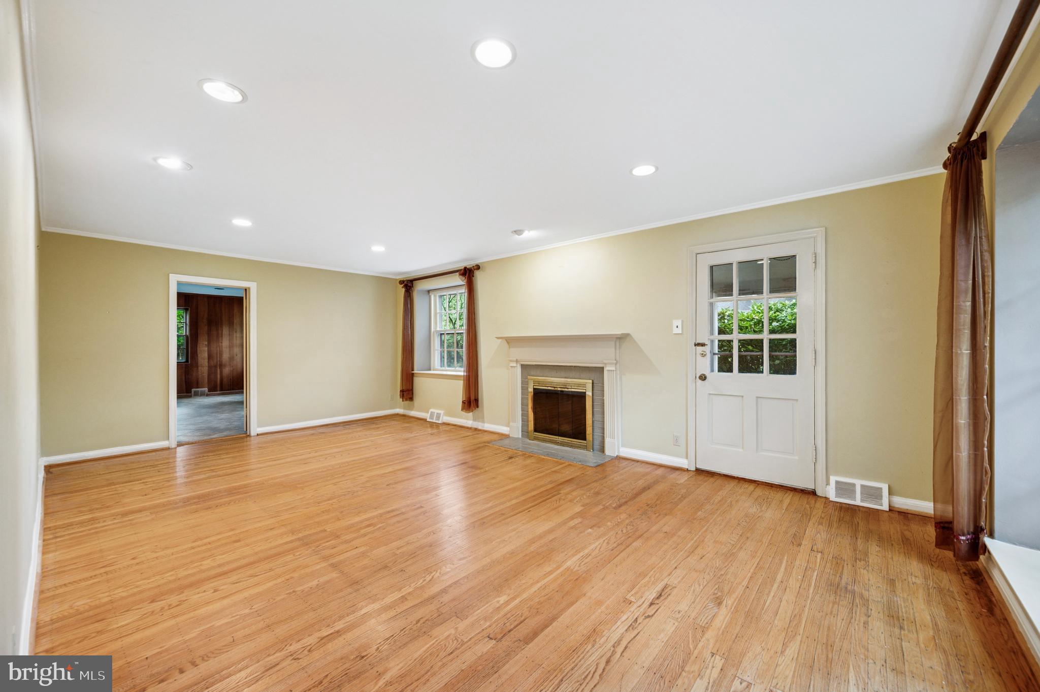 524 Lafayette Road Merion Station, PA 19066 - Photo 3 of 25 a view of empty room with wooden floor and fireplace
