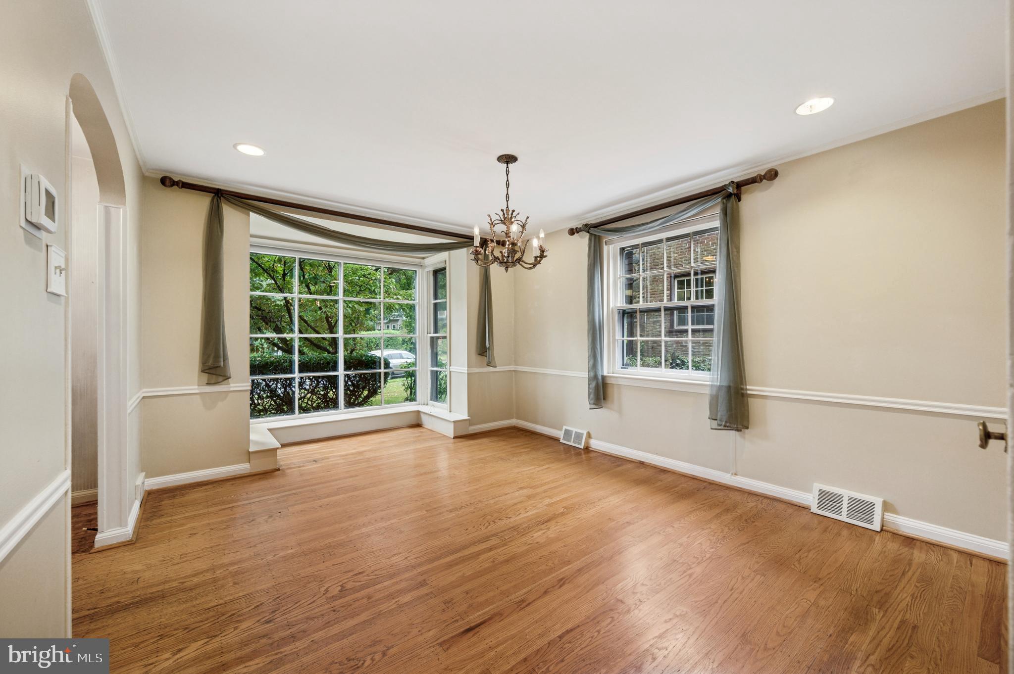 524 Lafayette Road Merion Station, PA 19066 - Photo 5 of 25 a view of an empty room with a window and wooden floor