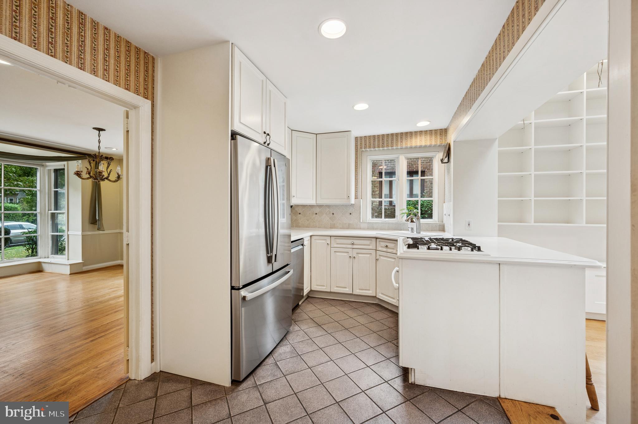 524 Lafayette Road Merion Station, PA 19066 - Photo 6 of 25 a kitchen with granite countertop cabinets and refrigerator