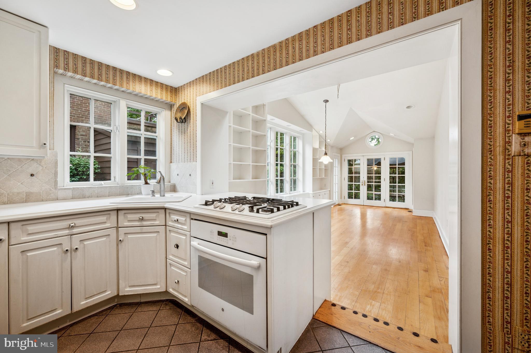 524 Lafayette Road Merion Station, PA 19066 - Photo 7 of 25 a kitchen with cabinets appliances and a window