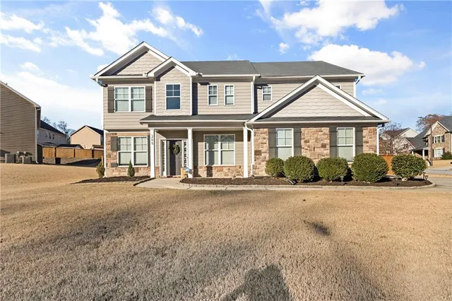 front view of a house with a yard