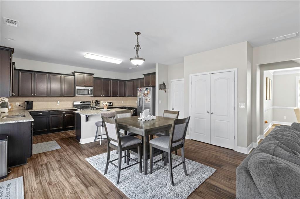 285 Paces Drive Lithia Springs, GA 30122 - Photo 12 of 45 a view of a dining room with furniture
