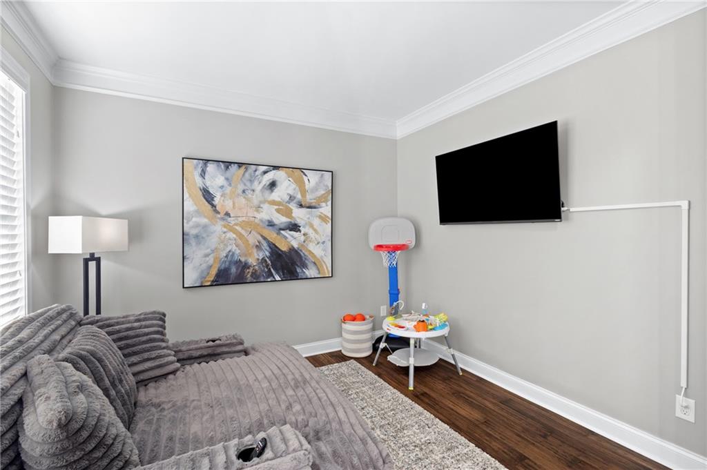 285 Paces Drive Lithia Springs, GA 30122 - Photo 17 of 45 a living room with furniture and a flat screen tv