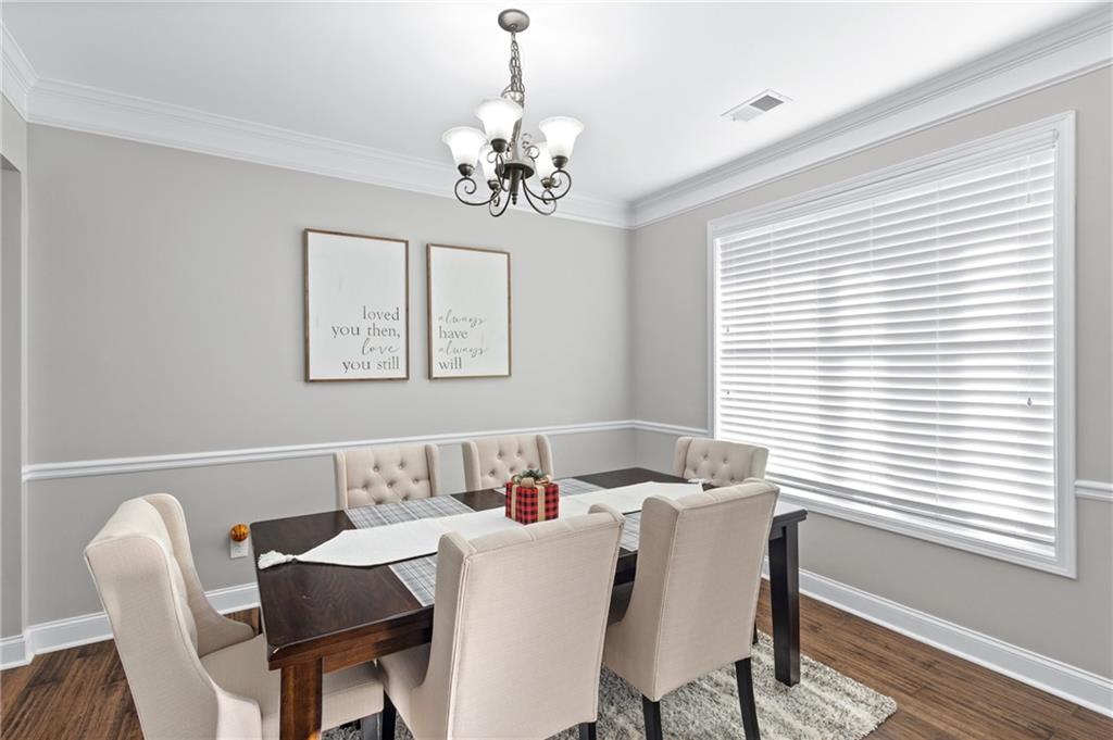 285 Paces Drive Lithia Springs, GA 30122 - Photo 18 of 45 a dining room with furniture and window