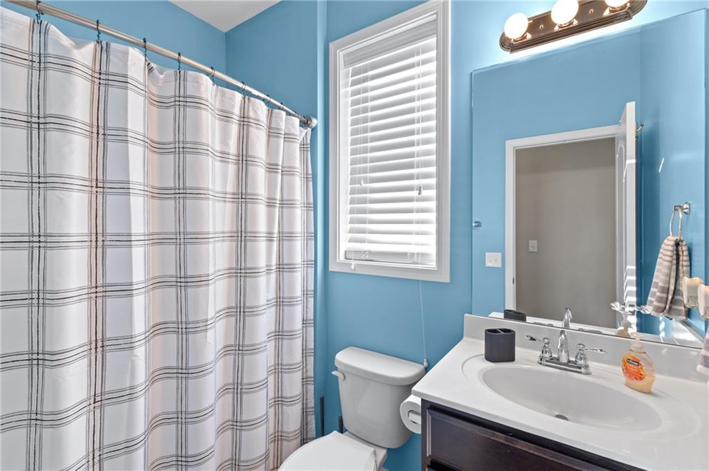 285 Paces Drive Lithia Springs, GA 30122 - Photo 20 of 45 a bathroom with a sink and a mirror