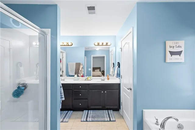 a bathroom with a sink a mirror and a bathtub