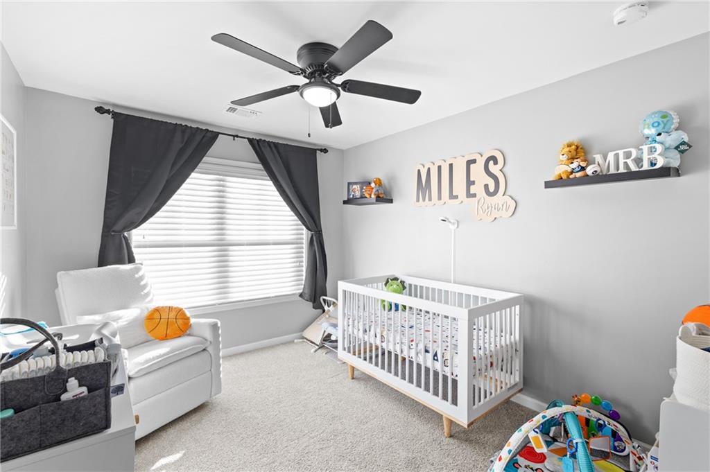 285 Paces Drive Lithia Springs, GA 30122 - Photo 33 of 45 a bedroom with furniture and a window