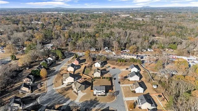 a view of houses with a street