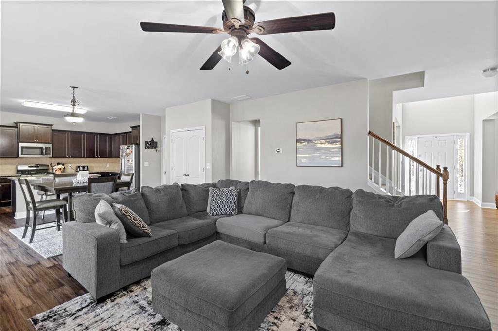 285 Paces Drive Lithia Springs, GA 30122 - Photo 5 of 45 a living room with furniture and a view of kitchen