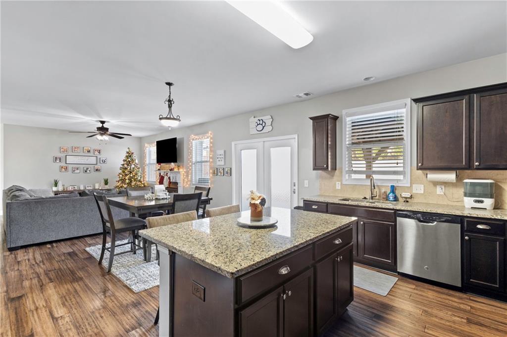 285 Paces Drive Lithia Springs, GA 30122 - Photo 8 of 45 a kitchen with granite countertop a sink and cabinets