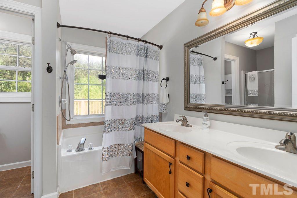 1820 Emerson Cook Road Pittsboro, NC 27312 - Photo 15 of 30 Relax after a long day of work or errands. This master bathroom has everything and more that could be desired.