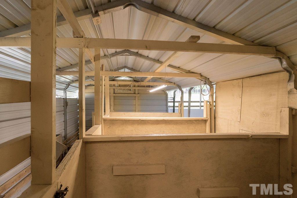 1820 Emerson Cook Road Pittsboro, NC 27312 - Photo 26 of 30 - Exterior kennel recently painted - Two additional water hand-pumps - Animal waterer in main pasture
