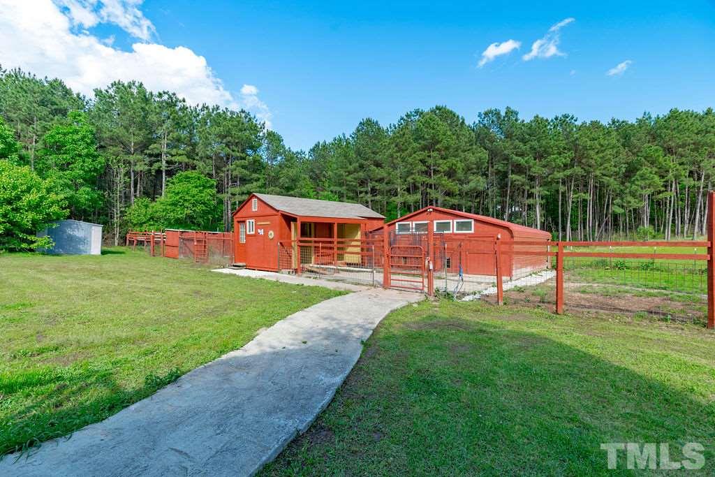 Fenced-in yard, pastures, dog/pet barn with 7 stalls, three storage sheds. This is the perfect home for animal lovers.