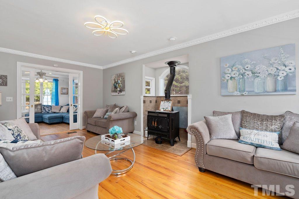 The family room offers immense sunlight and peaceful views along with a charming wood burning stove. Grab a glass of wine or hot cup of tea and enjoy the warmth of the fireplace on a cool winters day!