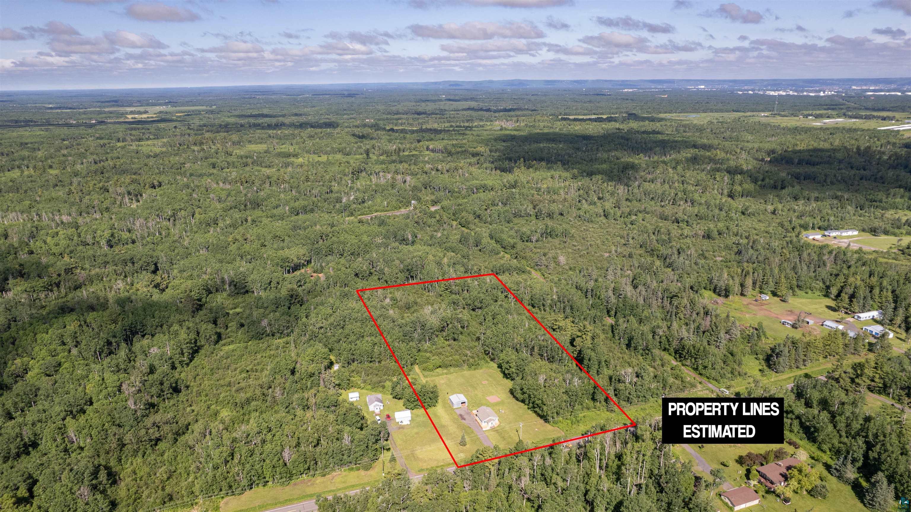 3835 South County Rd K South Range, WI 54874 - Photo 28 of 29 Expansive wooded lot with partial clearing, featuring a defined perimeter