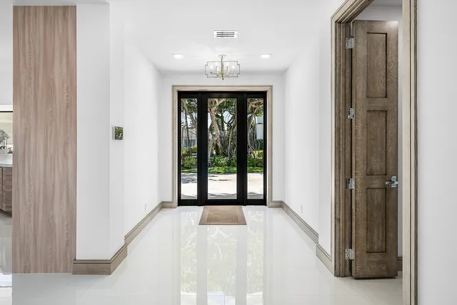 a view of a kitchen with furniture and floor to ceiling window