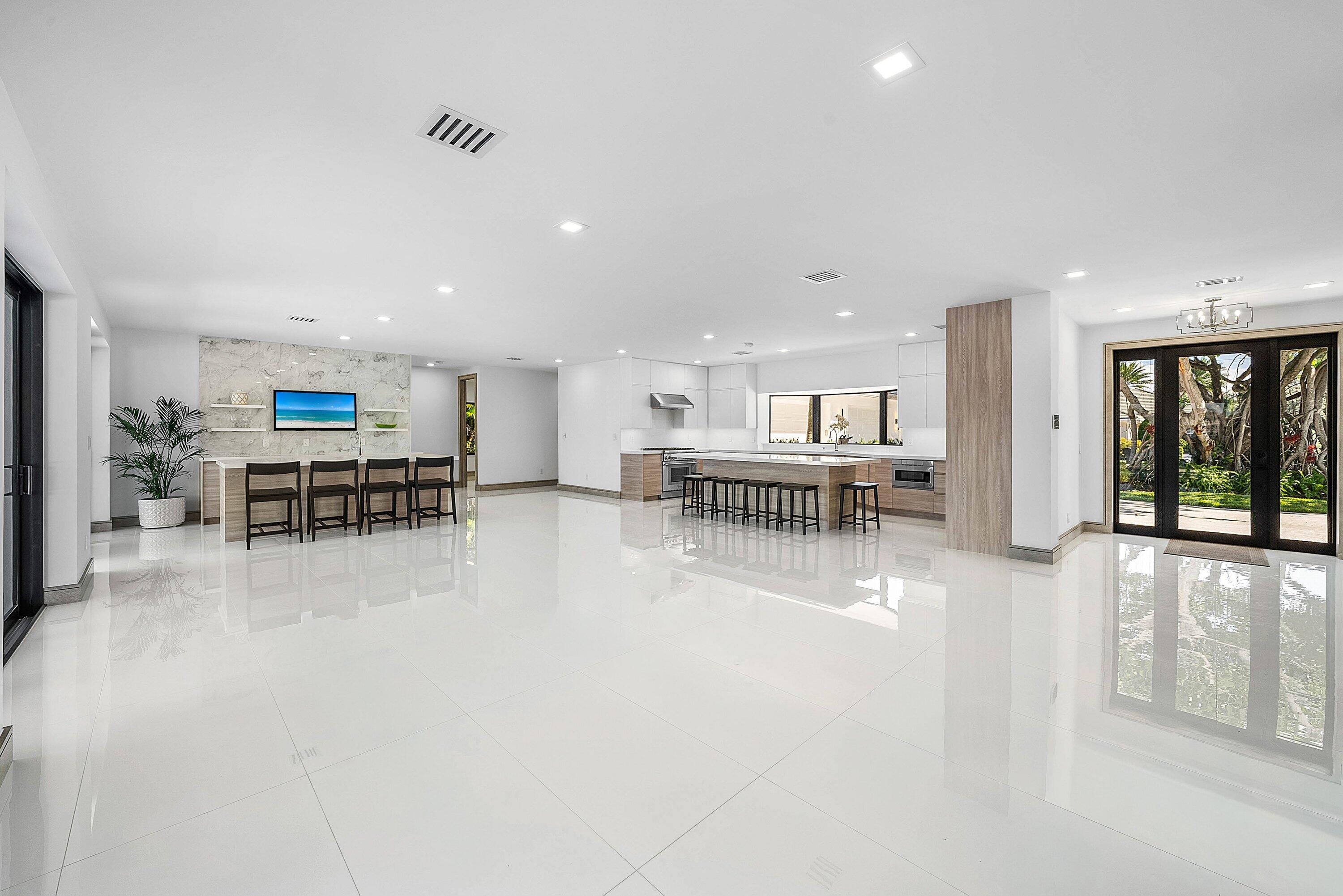 40 Spoonbill Road Manalapan, FL 33462 - Photo 16 of 67 a view of a kitchen with furniture and floor to ceiling window