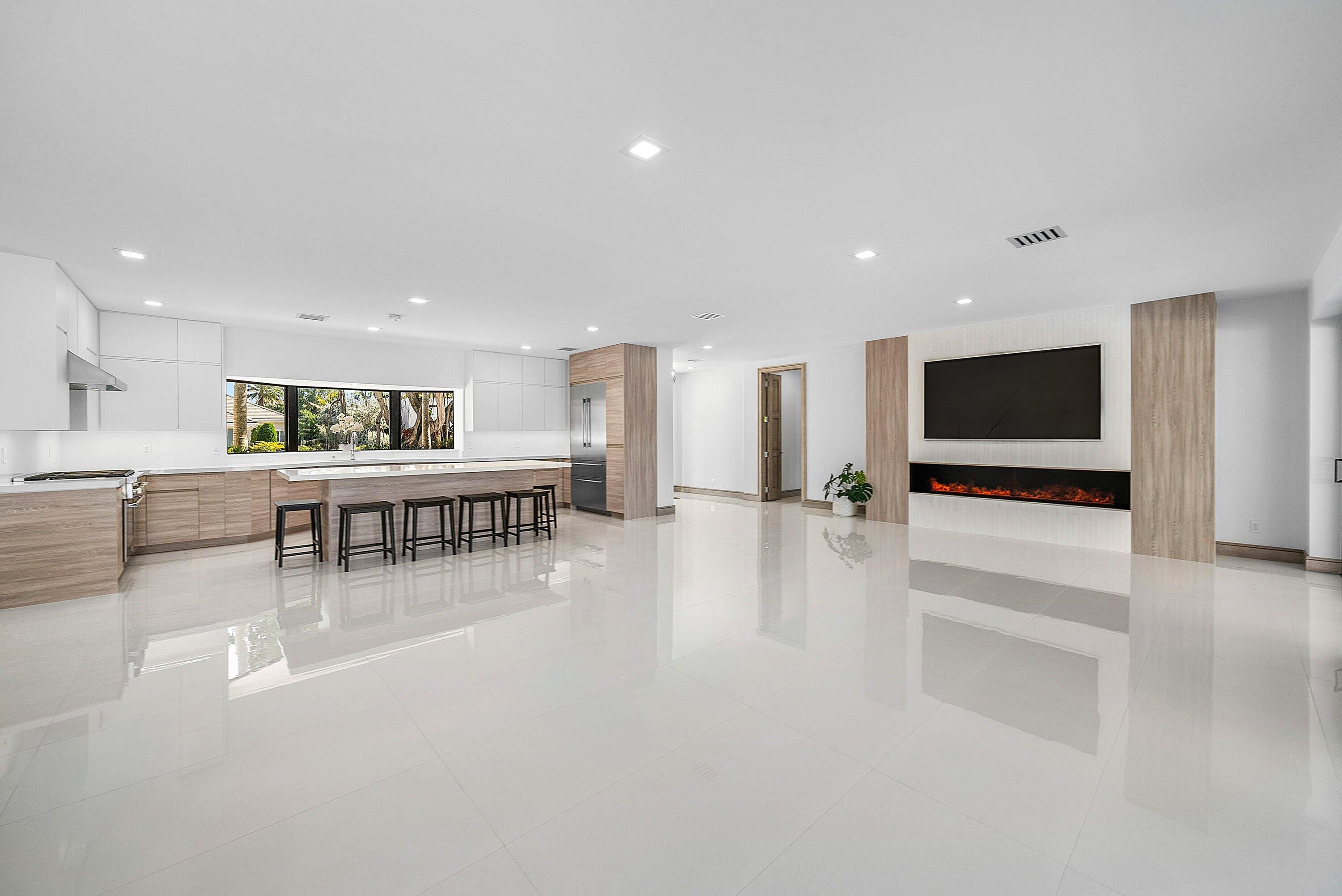 40 Spoonbill Road Manalapan, FL 33462 - Photo 18 of 67 a living room with furniture and a flat screen tv