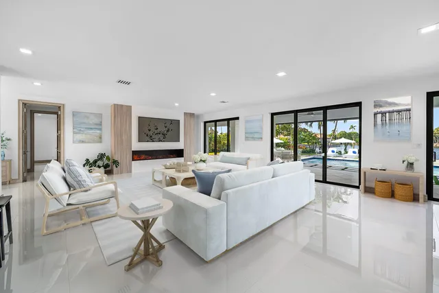 a large kitchen with a table and chairs