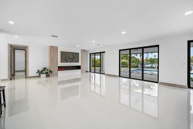 a large kitchen with a table chairs and a refrigerator