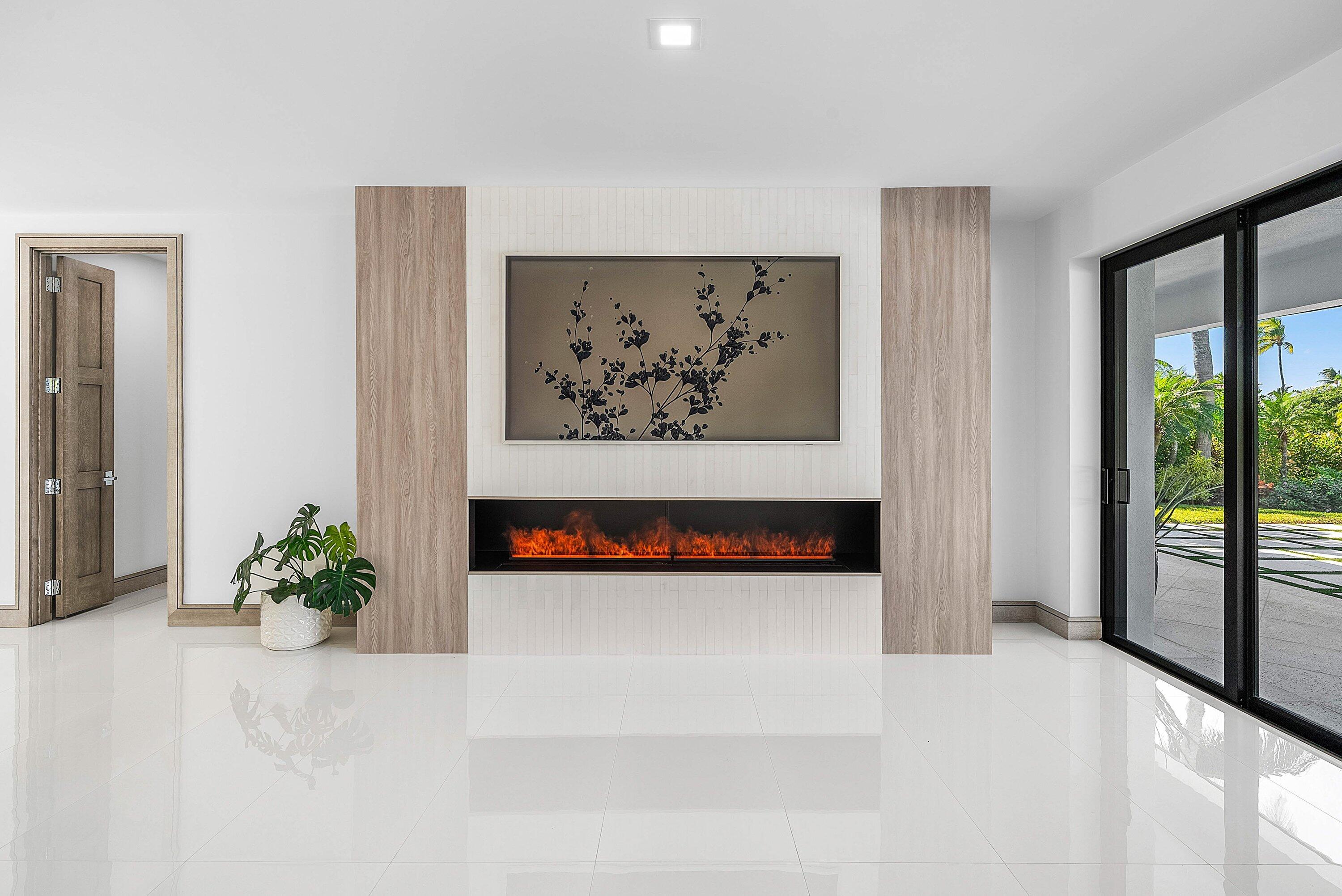 40 Spoonbill Road Manalapan, FL 33462 - Photo 21 of 67 a view of a hallway with paintings on the wall