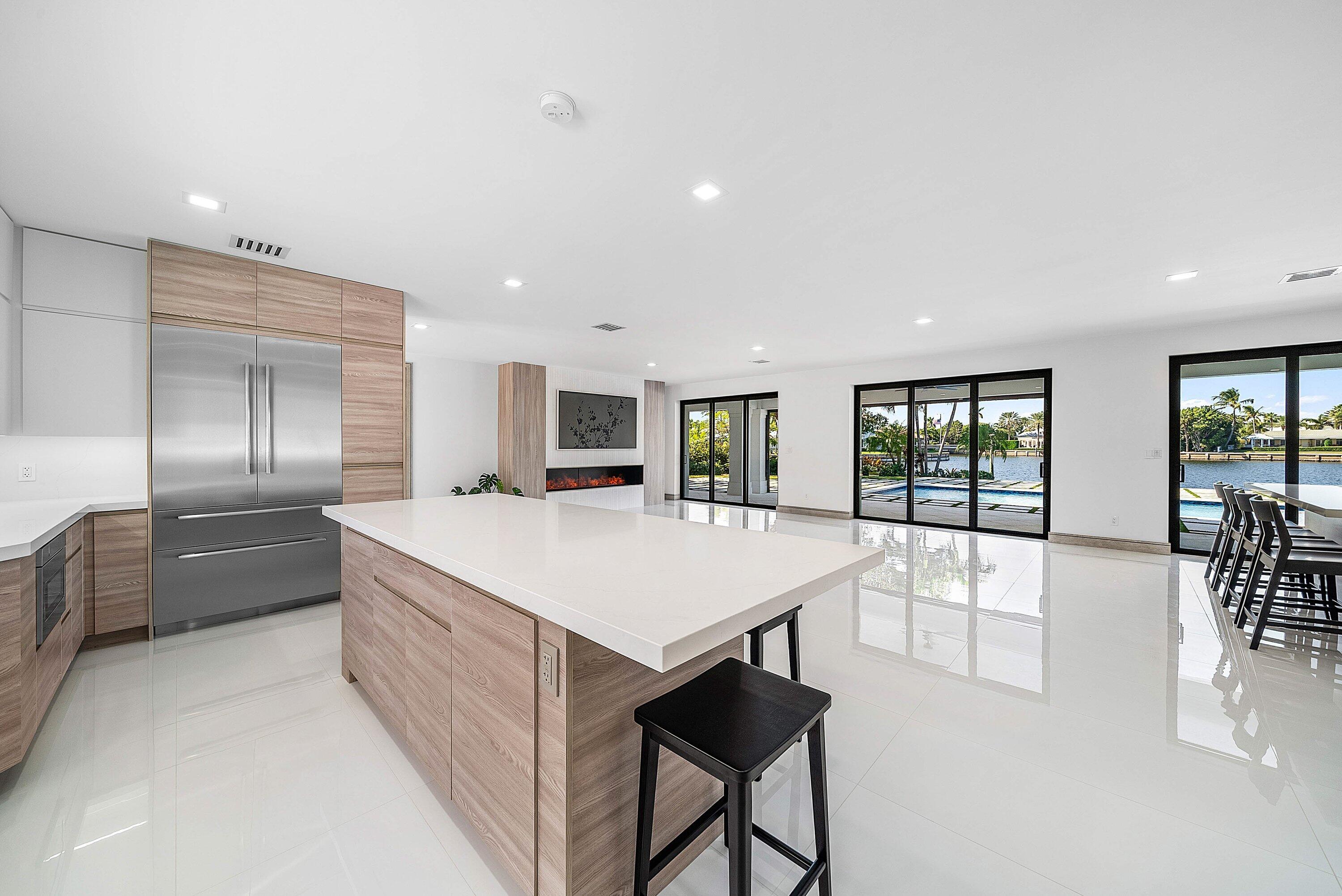 40 Spoonbill Road Manalapan, FL 33462 - Photo 25 of 67 a large kitchen with a table and chairs