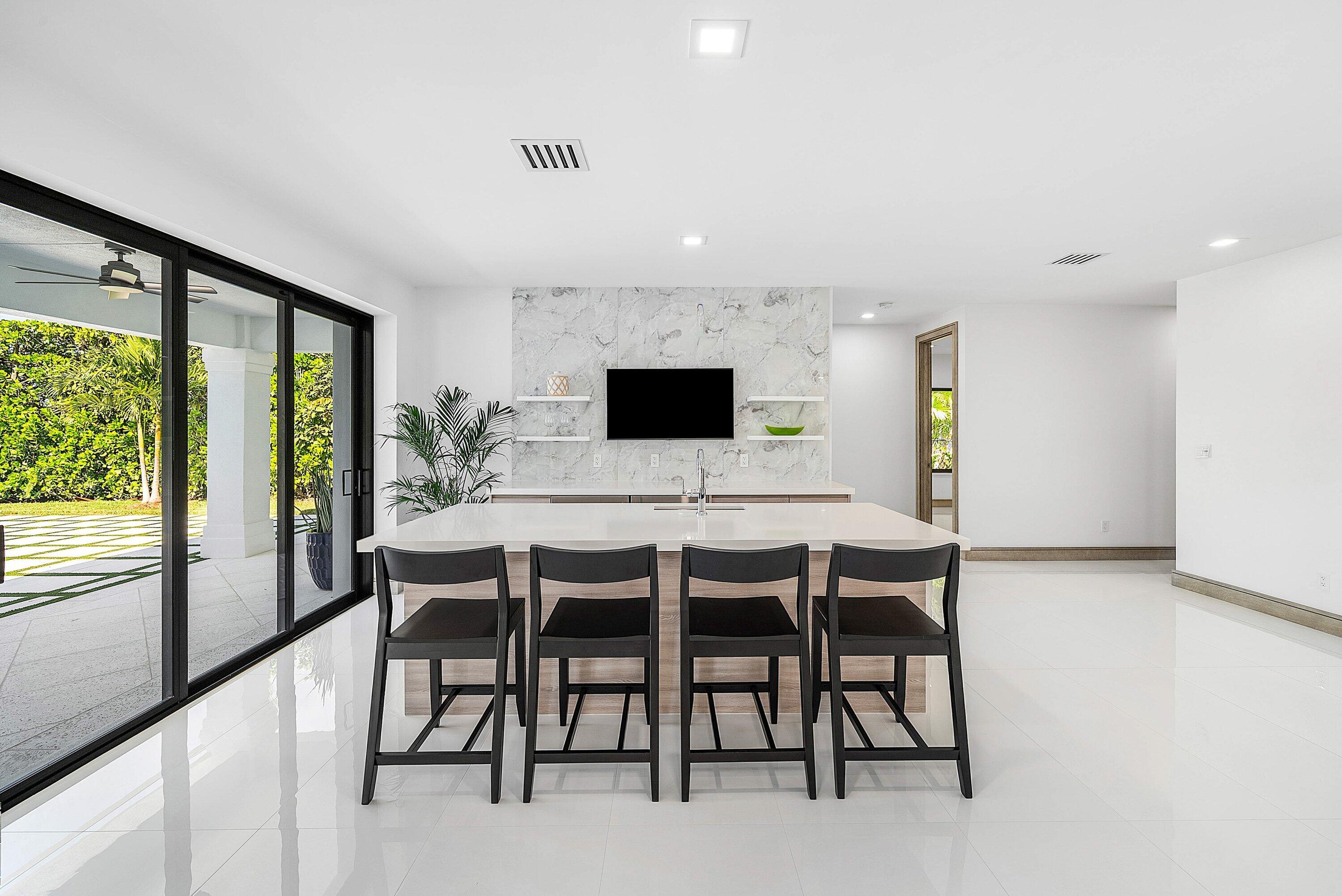 40 Spoonbill Road Manalapan, FL 33462 - Photo 29 of 67 a view of a dining room with furniture and window