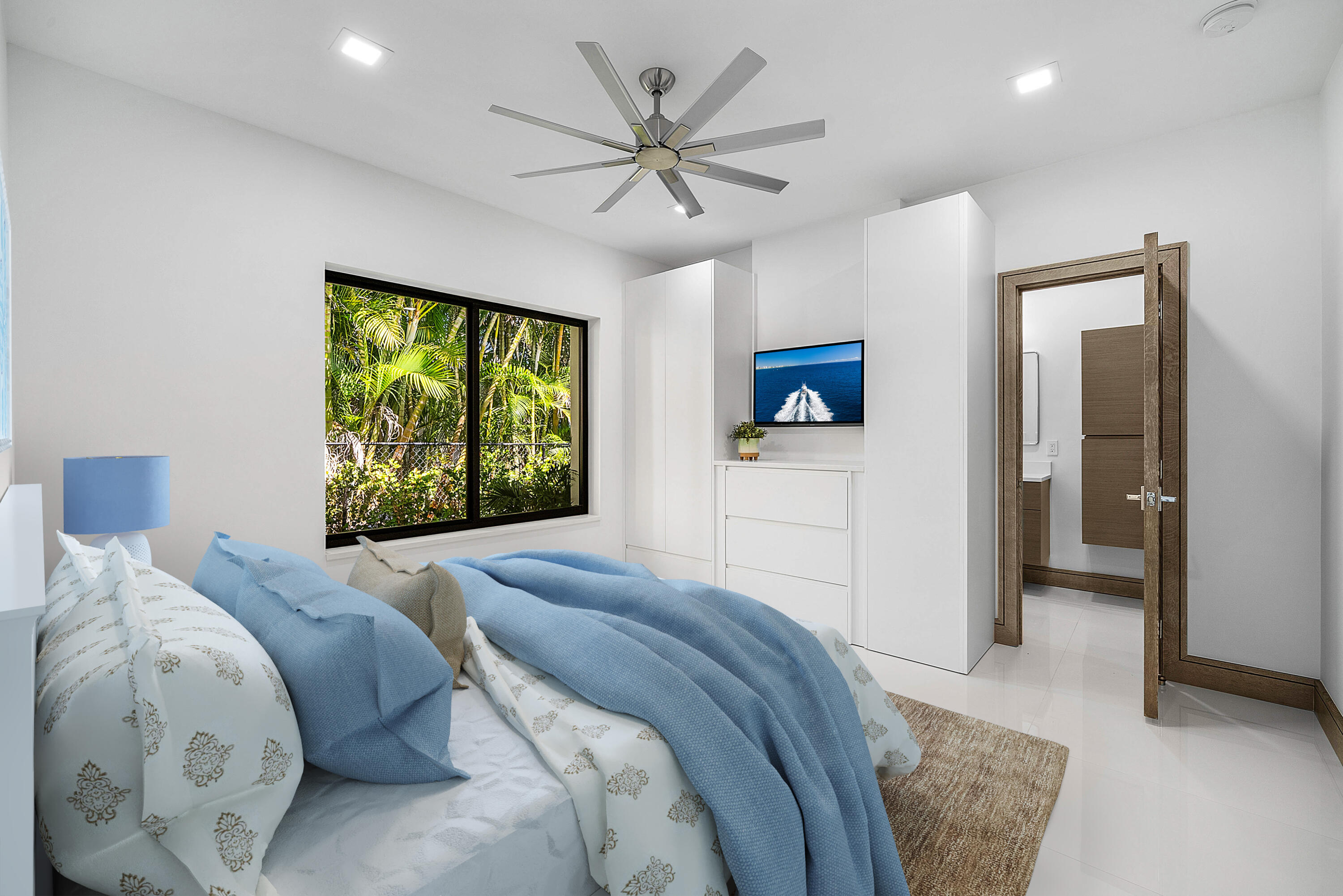 40 Spoonbill Road Manalapan, FL 33462 - Photo 35 of 67 a bedroom with a large bed and a chandelier