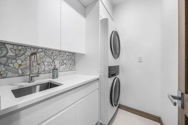 a bathroom with a double vanity sink mirror and shower