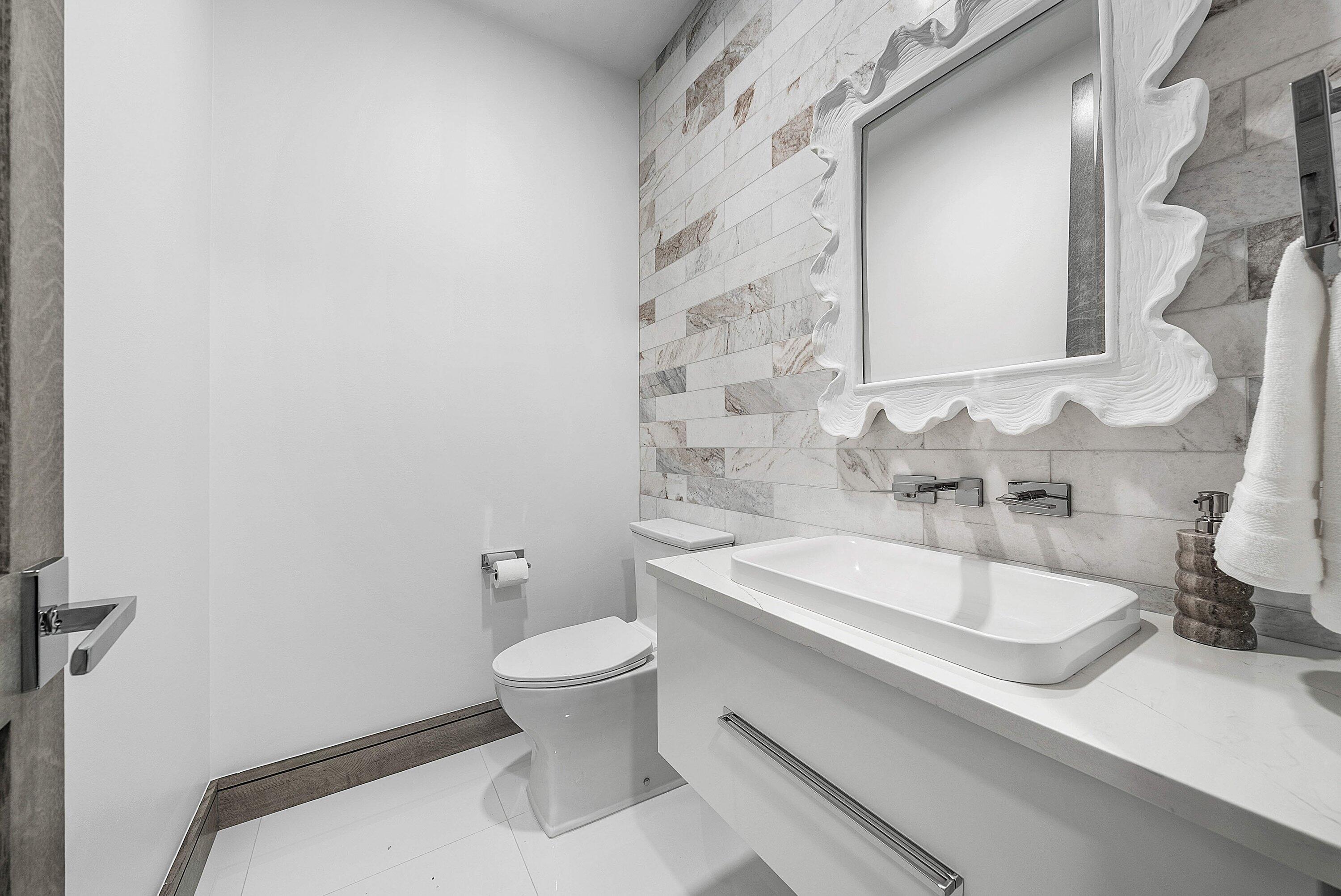 40 Spoonbill Road Manalapan, FL 33462 - Photo 40 of 67 a bathroom with a sink and a toilet