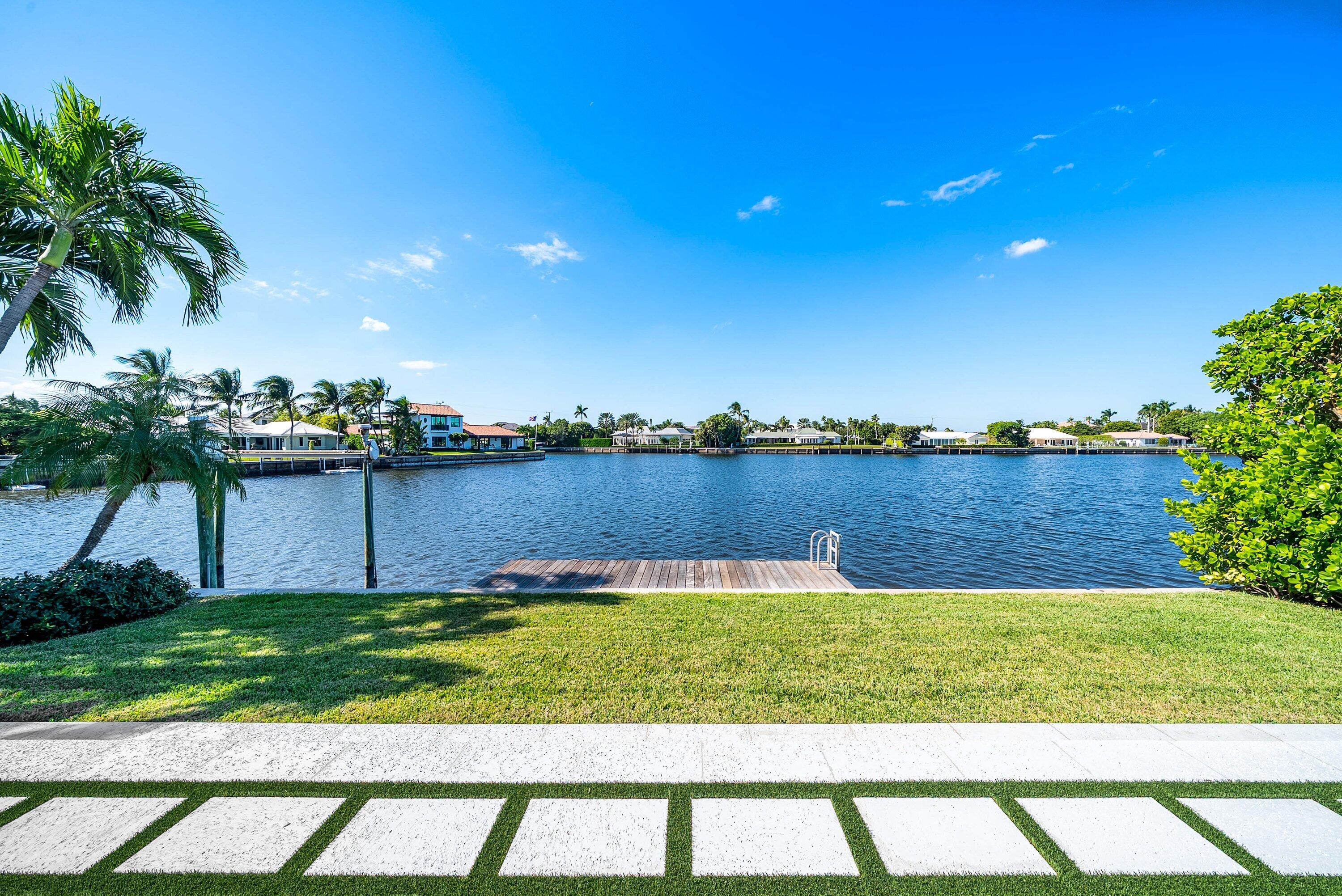 40 Spoonbill Road Manalapan, FL 33462 - Photo 4 of 67 a view of a lake with houses in the background