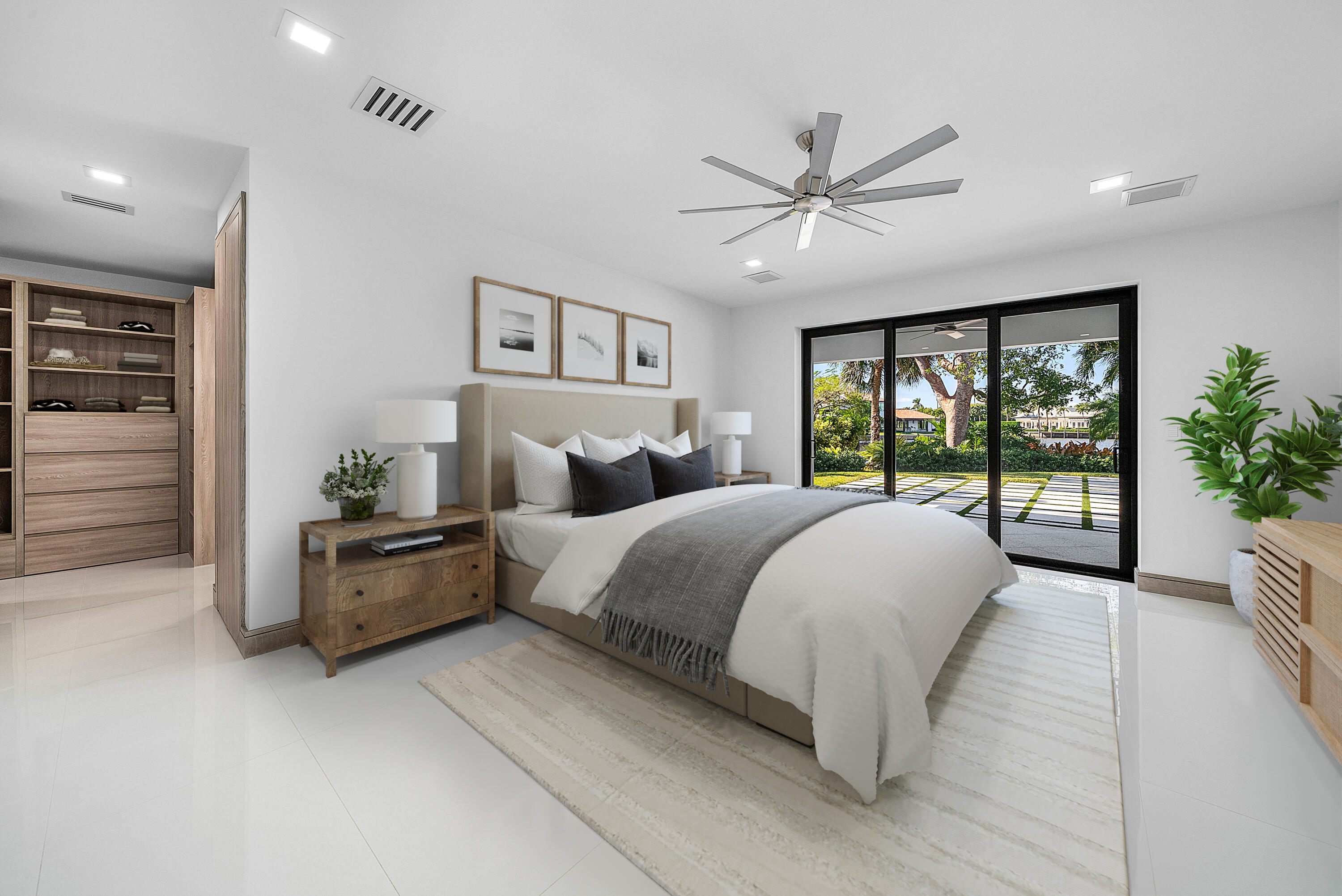 40 Spoonbill Road Manalapan, FL 33462 - Photo 47 of 67 a bedroom with a large bed and a large window