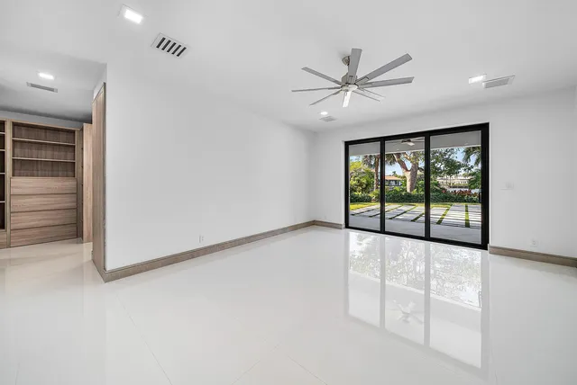 a view of a lake with houses in the background