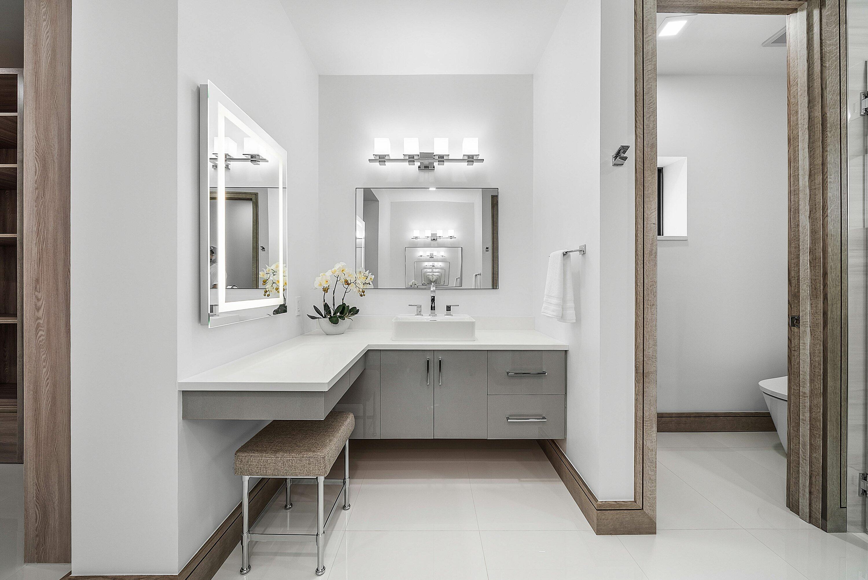 40 Spoonbill Road Manalapan, FL 33462 - Photo 49 of 67 a bathroom with a sink vanity and a mirror