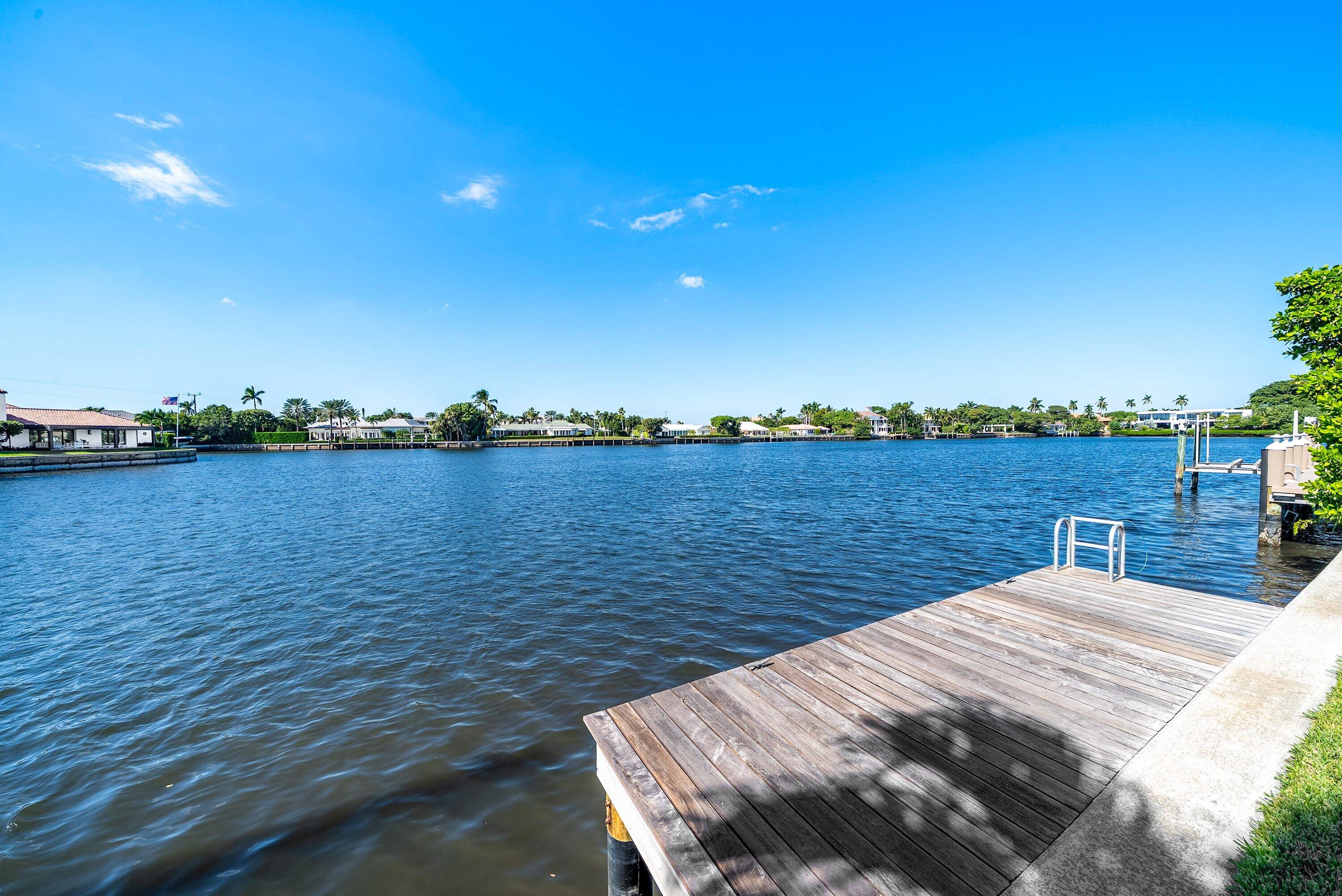 40 Spoonbill Road Manalapan, FL 33462 - Photo 60 of 67 a view of a lake with a big yard