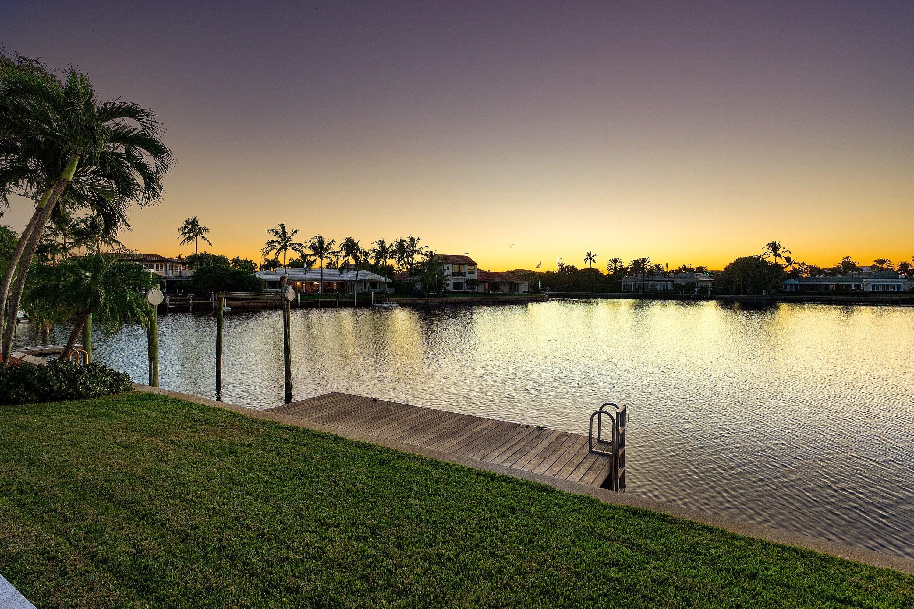 40 Spoonbill Road Manalapan, FL 33462 - Photo 8 of 67 a view of a lake with a palm trees