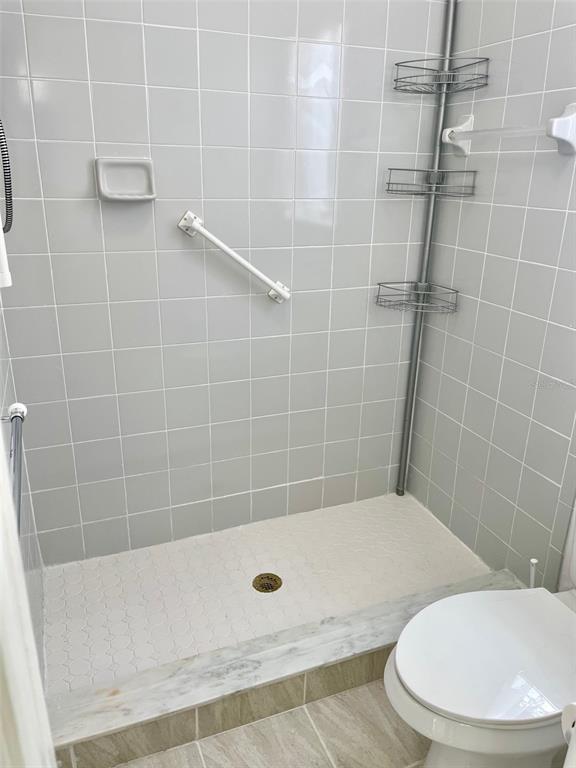 13100 South McCall Road, Unit 125 Port Charlotte, FL 33981 - Photo 11 of 19 a bathroom with a bathtub and toilet