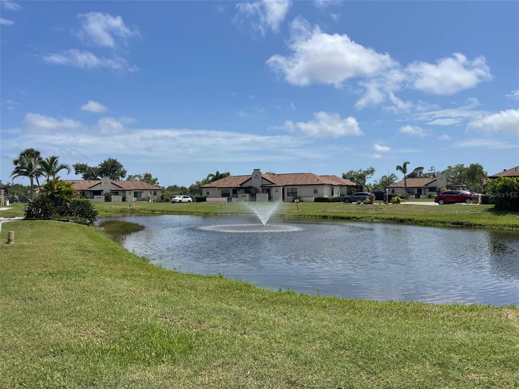 13100 South McCall Road, Unit 125 Port Charlotte, FL 33981 - Photo 3 of 19 a view of a lake with houses in the back
