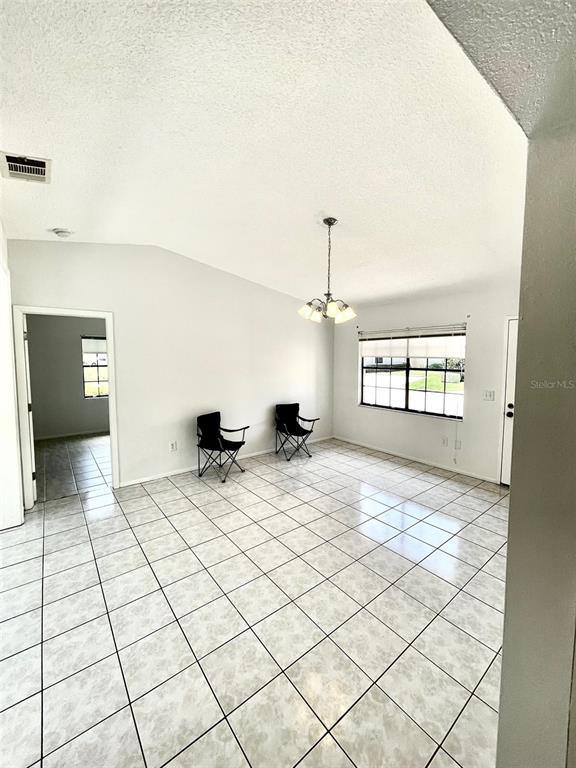 13100 South McCall Road, Unit 125 Port Charlotte, FL 33981 - Photo 9 of 19 a view of an empty room and window