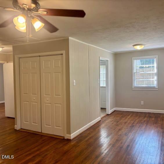 1505 Old Ivey Road Apex, NC 27523 - Photo 3 of 10 an empty room with wooden floor closet and windows